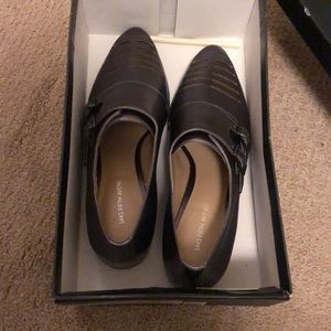 Saks fifth avenue. Metallic gray or says in the box  dark gunmetal shoes